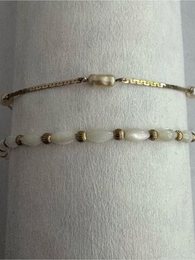 Two vintage Avon Gold Tone bracelets. Mother of Pearl